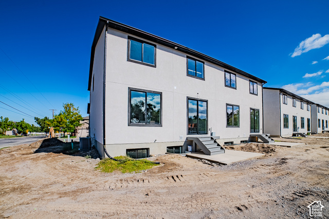 342 Perrine Drive Midvale, UT 84047 - Photo 37 of 37 Modern multi-story exterior with white stucco finish