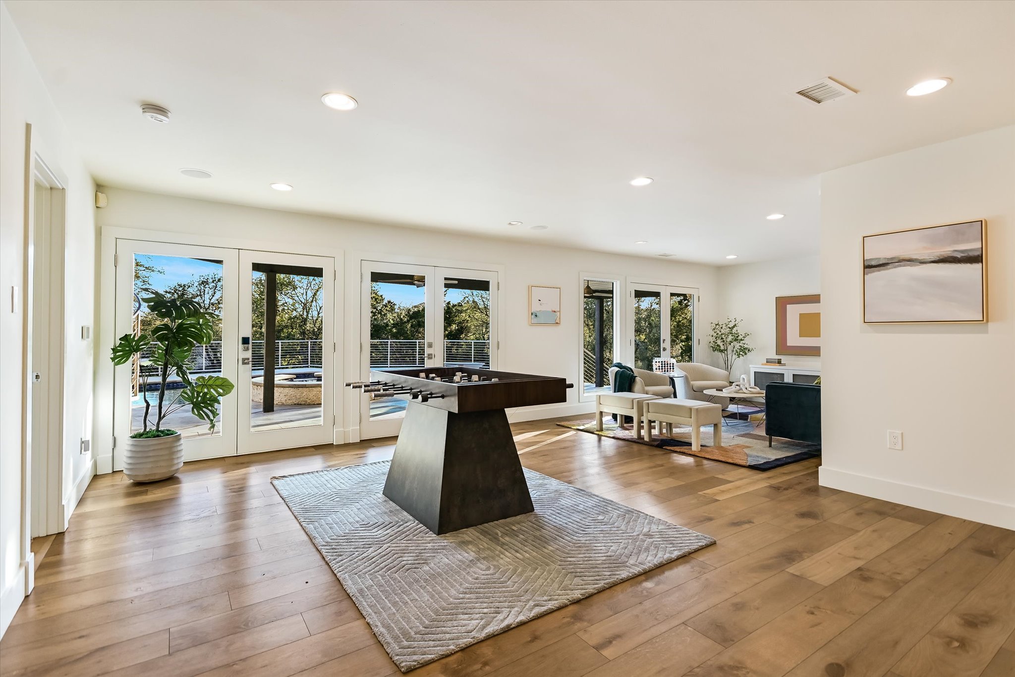 14 Rob Roy Road Austin, TX 78746 - Photo 16 of 40 a living room with furniture large window and wooden floor