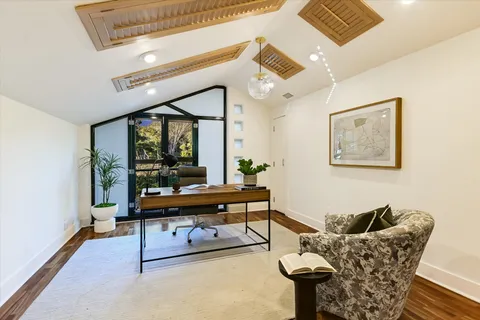 a bed room with a bed and a window