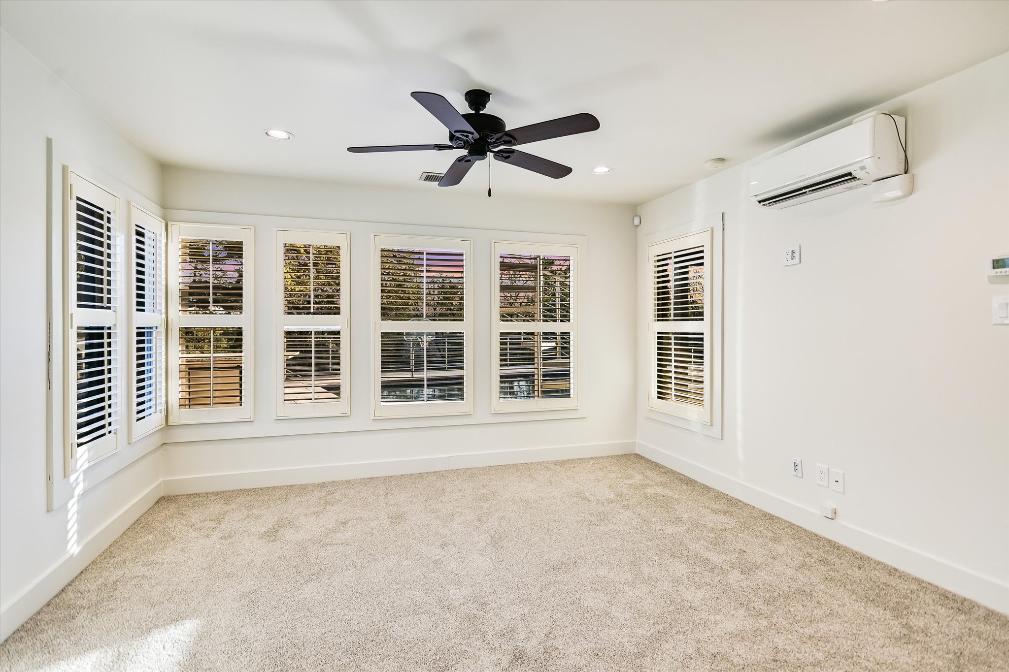 14 Rob Roy Road Austin, TX 78746 - Photo 27 of 40 a view of an empty room with a window and a ceiling fan