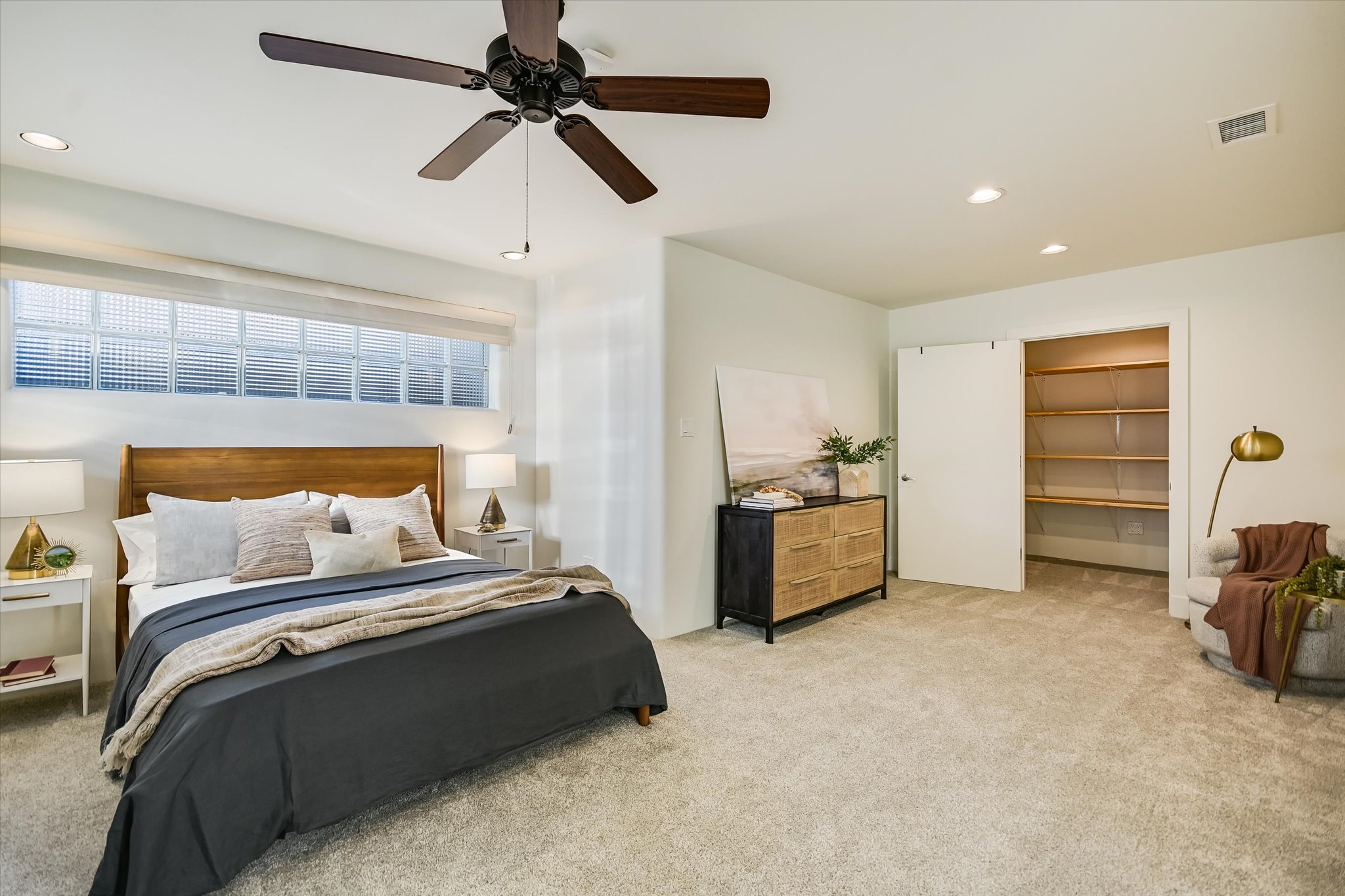 14 Rob Roy Road Austin, TX 78746 - Photo 28 of 40 a bedroom with a bed and a walk in closet