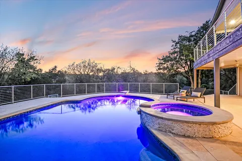 a view of a backyard with sitting area