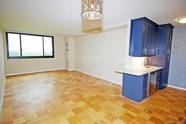 a kitchen with granite countertop a sink and a stove