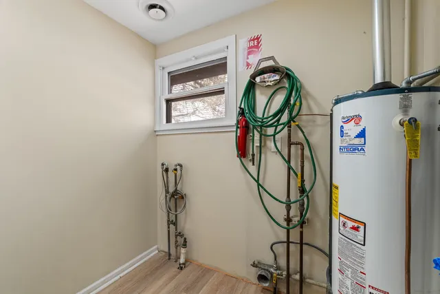 a utility room with gym equipment and a window