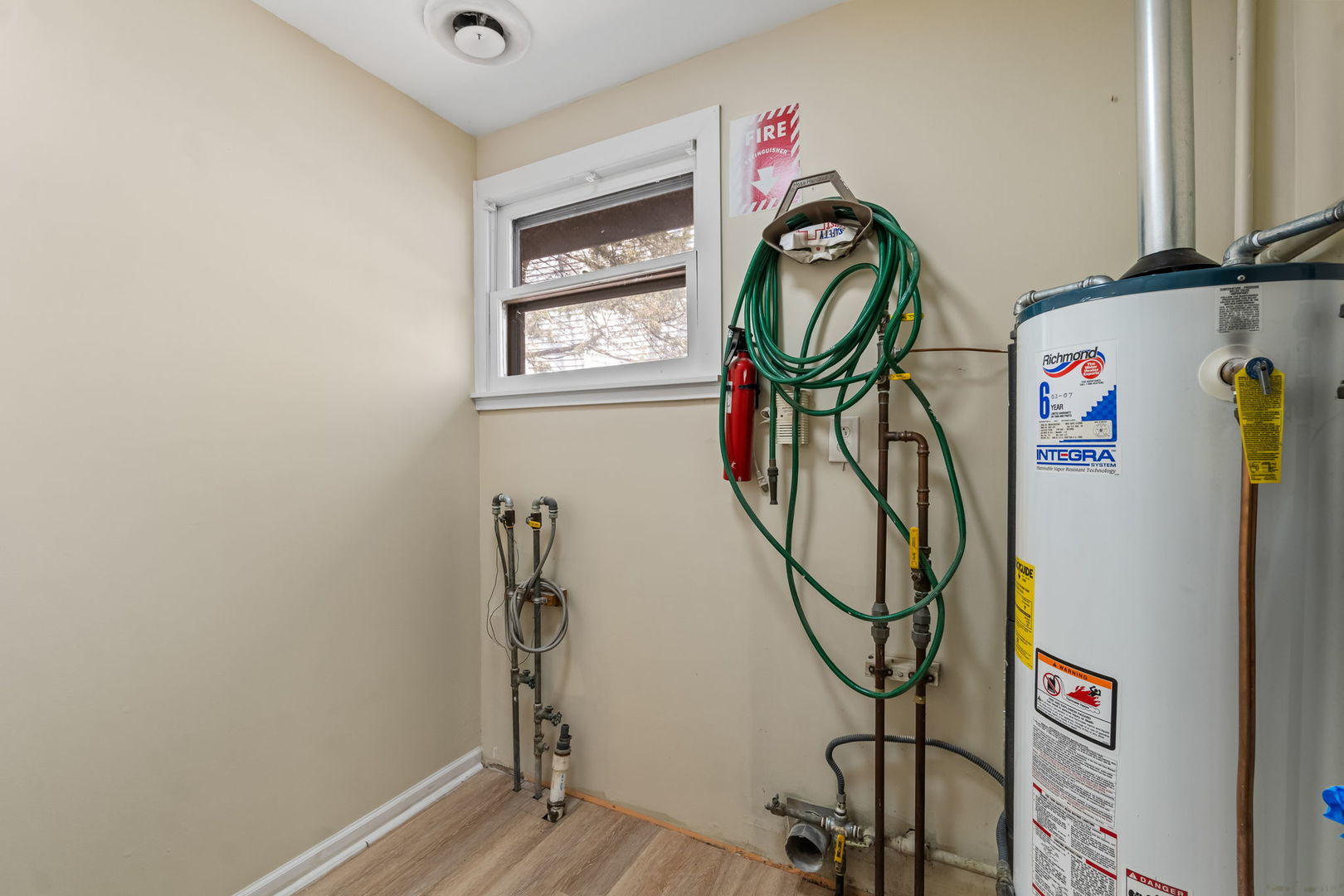 7730 Virginia Court Willowbrook, IL 60527 - Photo 22 of 23 a utility room with gym equipment and a window