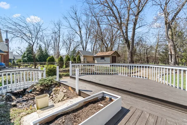 a view of a deck with a floor and fence