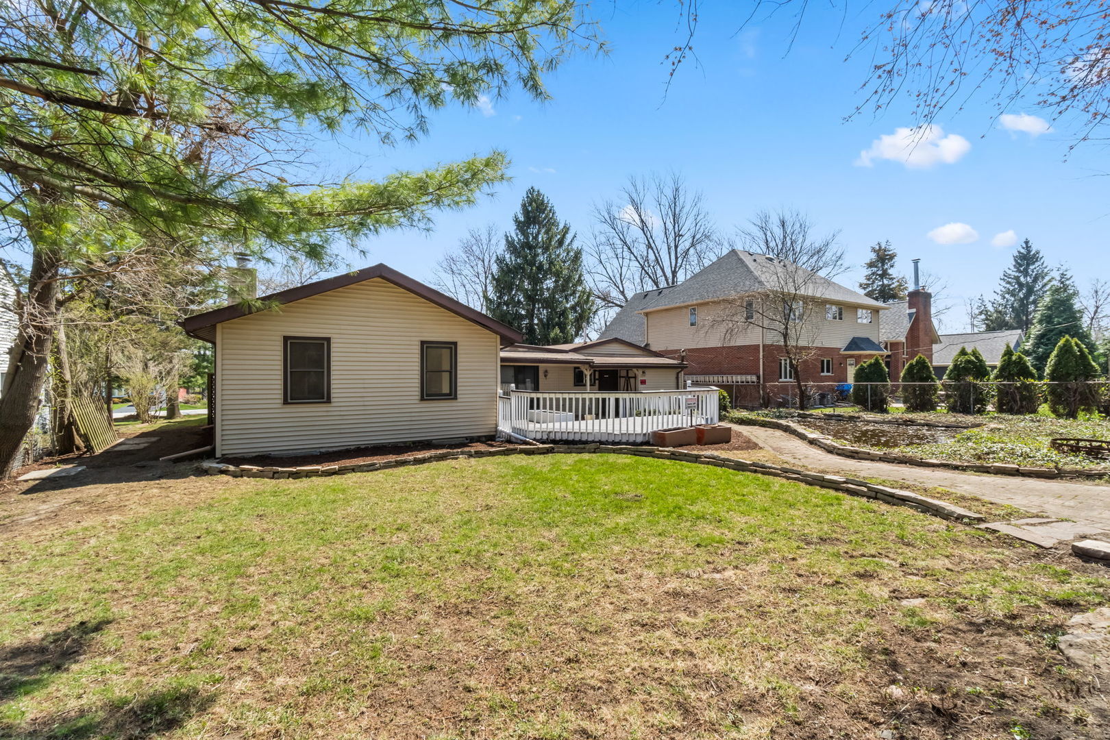 7730 Virginia Court Willowbrook, IL 60527 - Photo 3 of 23 a view of a house with swimming pool and sitting area