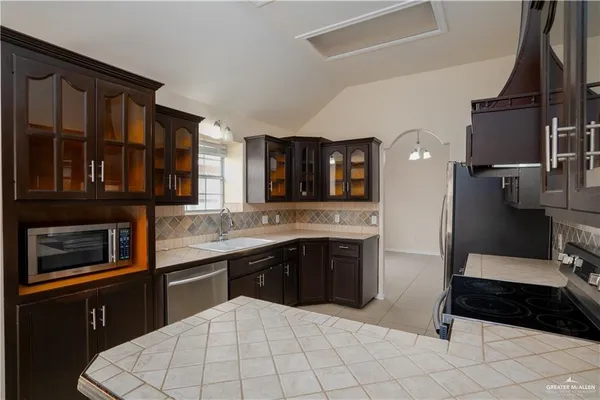 a kitchen with a sink and cabinets