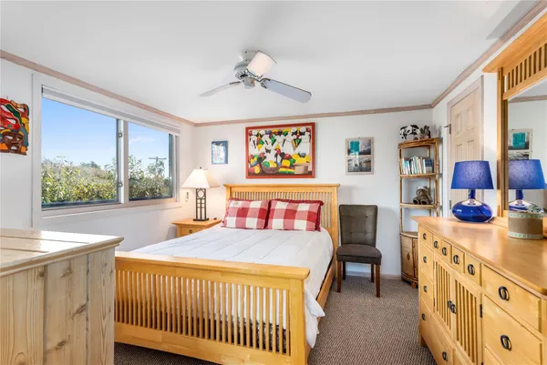 a bedroom with a bed and a table in it