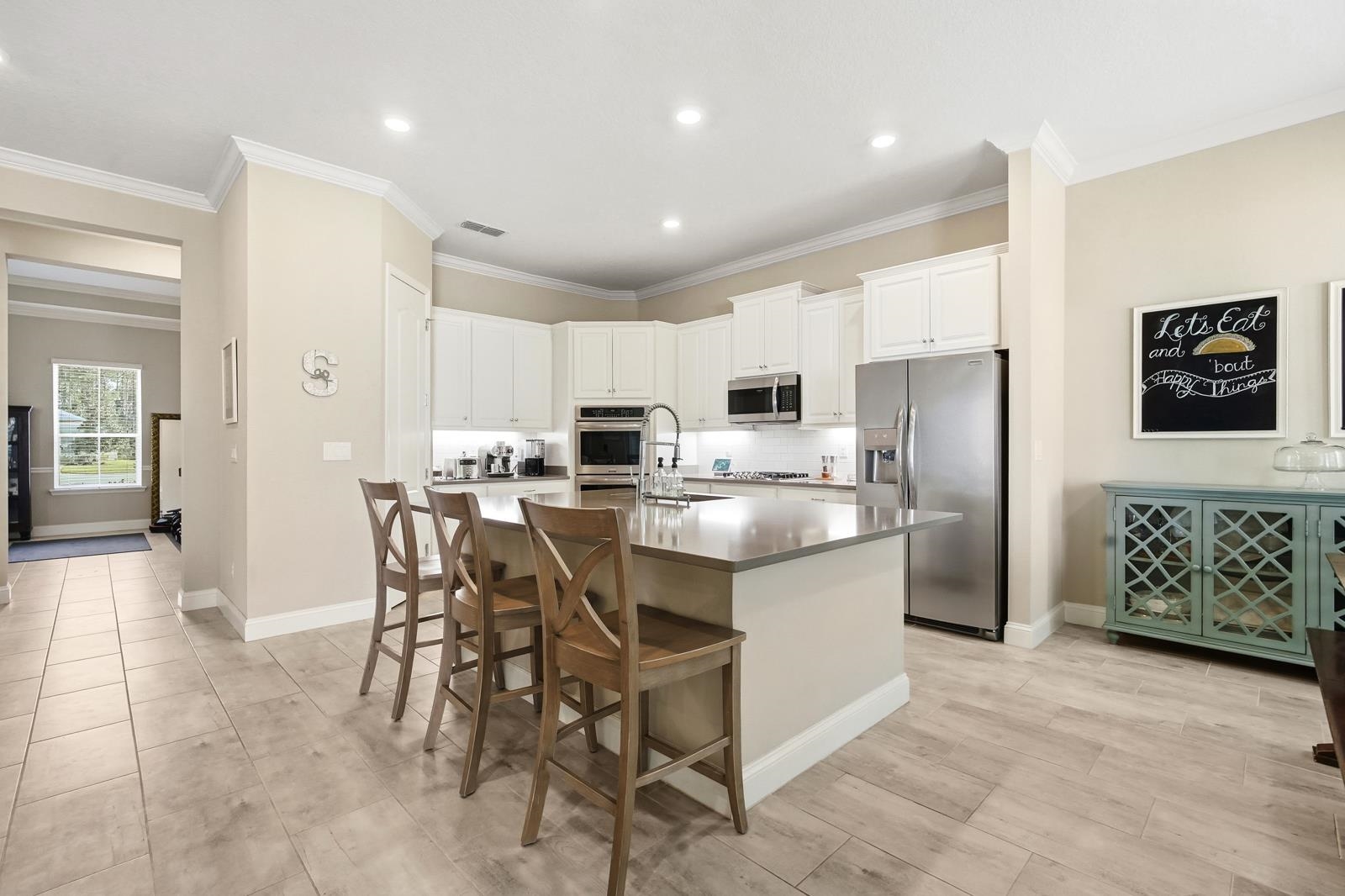 170 Antolin Way St. Augustine, FL 32095 - Photo 21 of 85 a large kitchen with a table and chairs