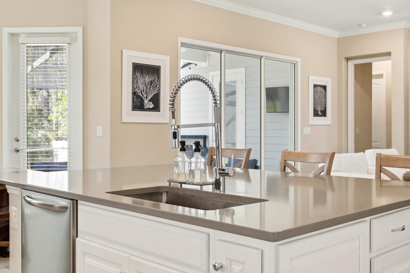170 Antolin Way St. Augustine, FL 32095 - Photo 23 of 85 Kitchen featuring white cabinets, dishwasher, crown molding, and dark stone countertops