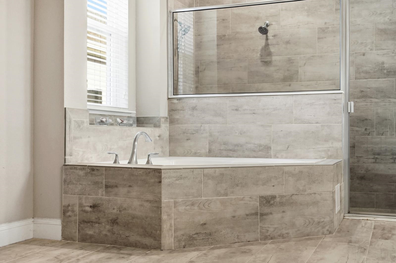 170 Antolin Way St. Augustine, FL 32095 - Photo 34 of 85 a bathroom with a granite countertop shower a sink and a window