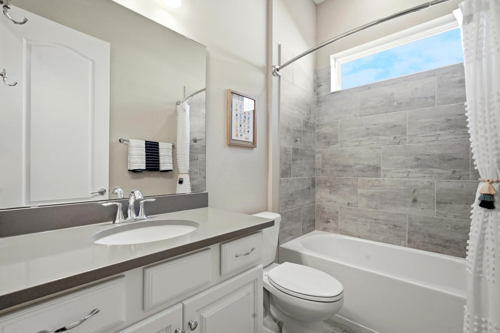 170 Antolin Way St. Augustine, FL 32095 - Photo 38 of 85 a bathroom with a granite countertop sink a toilet and shower