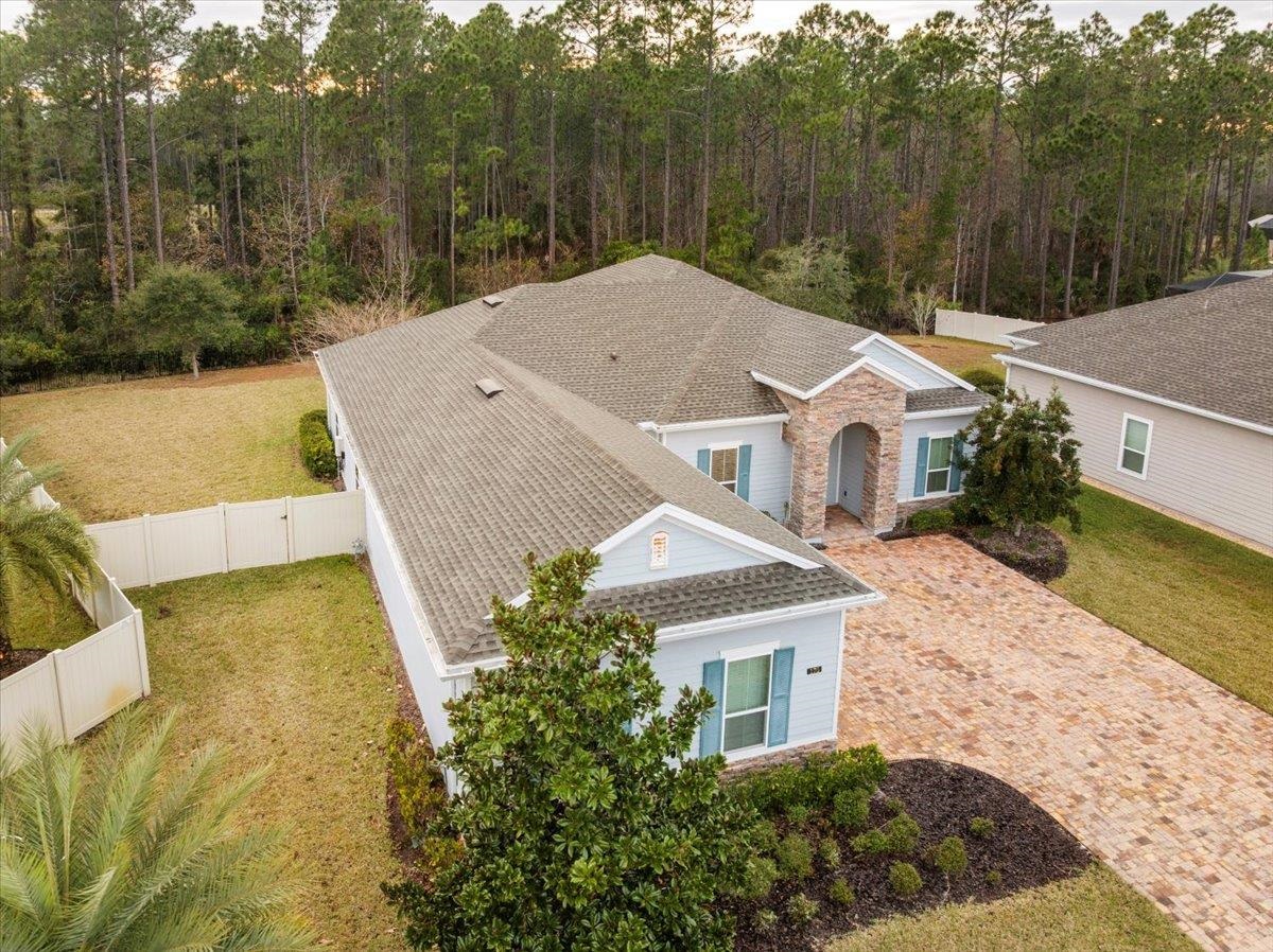 170 Antolin Way St. Augustine, FL 32095 - Photo 64 of 85 a view of a white house next to a yard with large trees