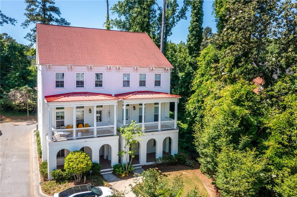 612 Brennan Drive Decatur, GA 30033 - Photo 1 of 1 a view of a white house with large windows and plants