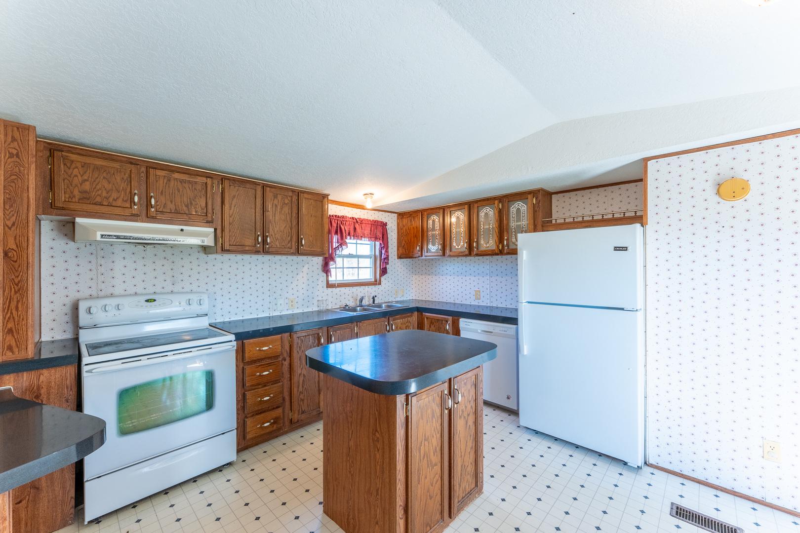 24555 Legion Road Stonefort, IL 62987 - Photo 12 of 41 a kitchen with stainless steel appliances granite countertop a sink stove and refrigerator