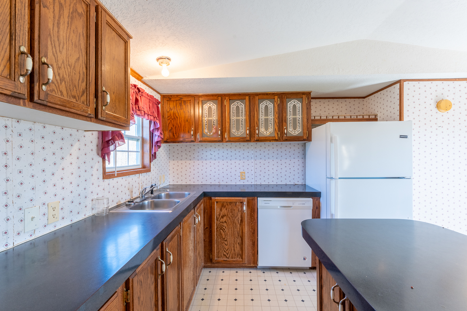 24555 Legion Road Stonefort, IL 62987 - Photo 15 of 41 a kitchen with stainless steel appliances granite countertop a sink a stove and a microwave