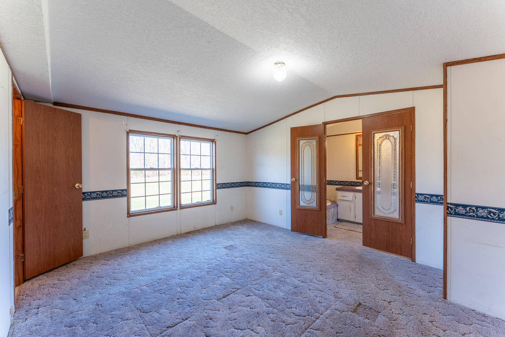 24555 Legion Road Stonefort, IL 62987 - Photo 18 of 41 an empty room with windows and closet