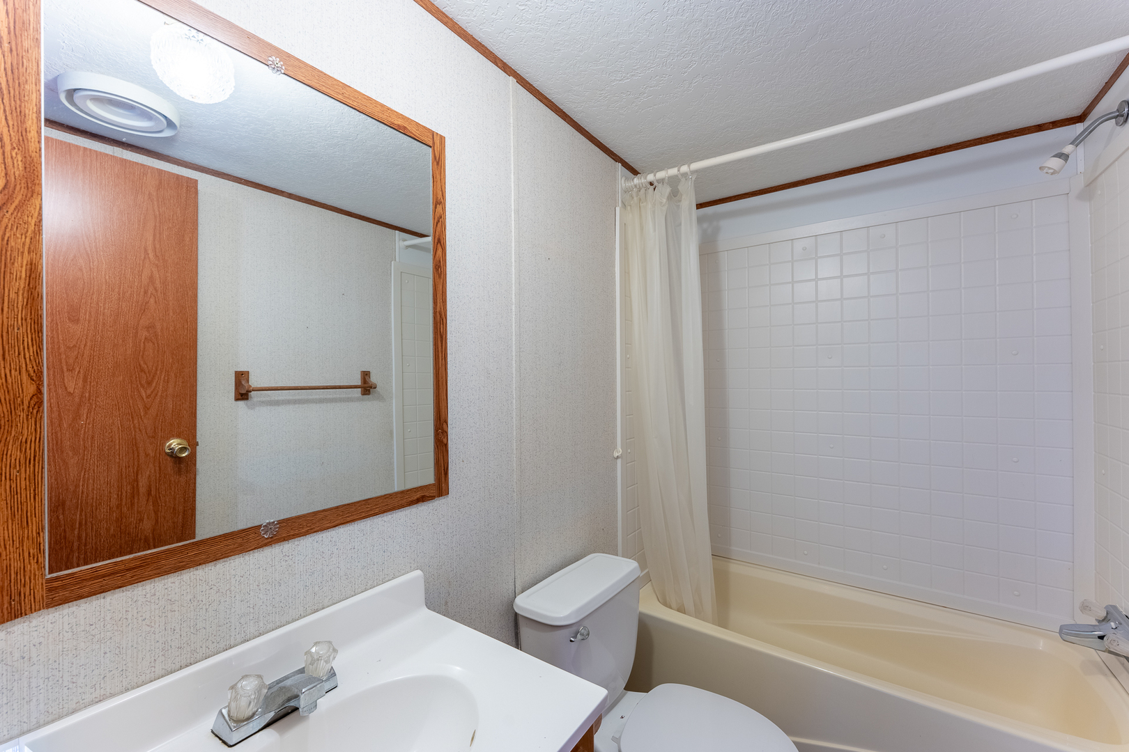 24555 Legion Road Stonefort, IL 62987 - Photo 25 of 41 a bathroom with a granite countertop bathtub shower sink vanity and toilet