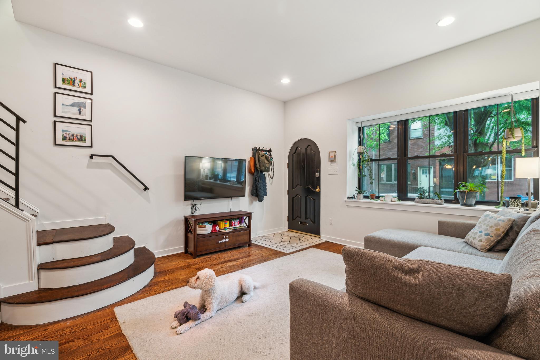 1319 Tasker Street Philadelphia, PA 19148 - Photo 12 of 23 a living room with furniture and a flat screen tv