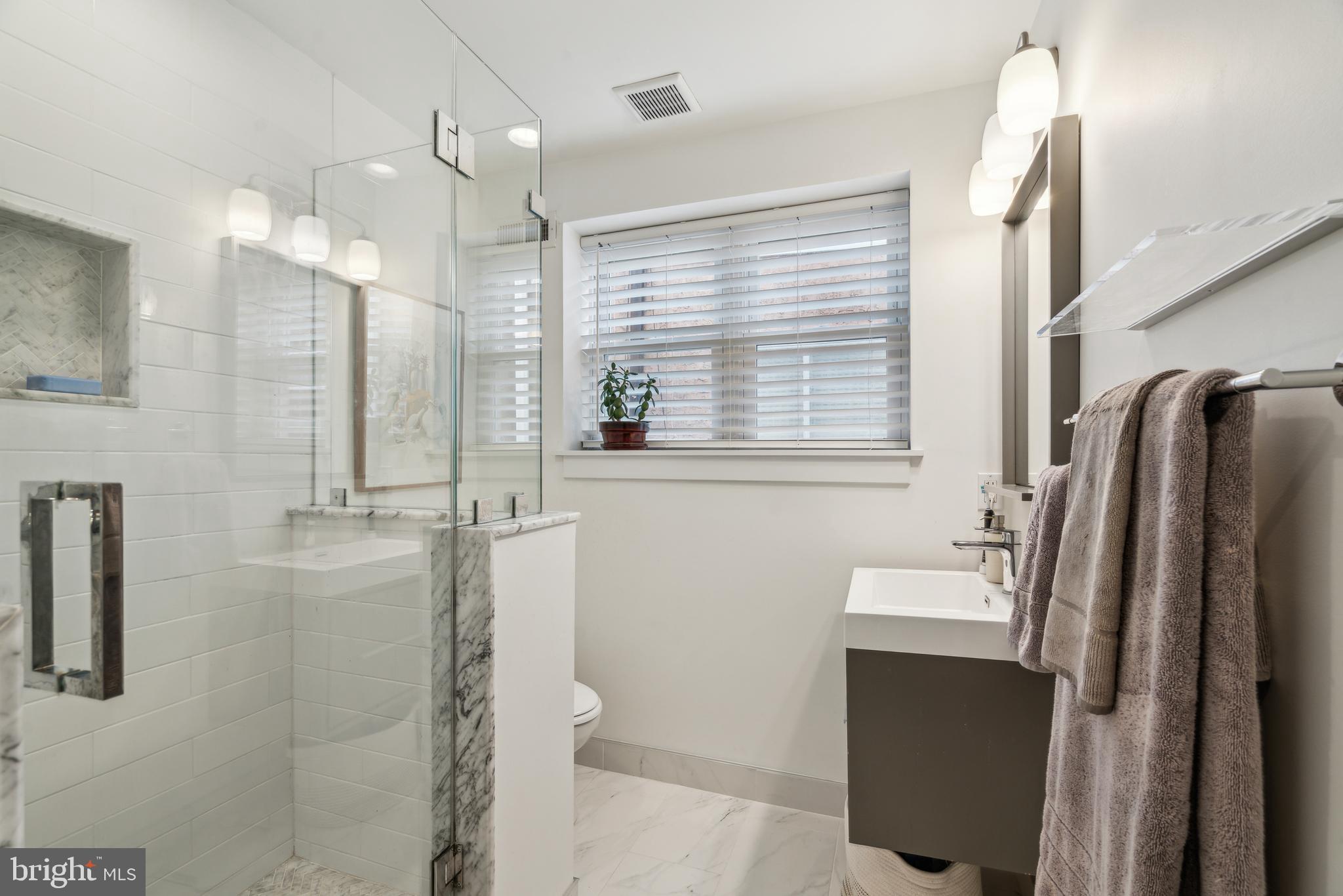 1319 Tasker Street Philadelphia, PA 19148 - Photo 20 of 23 a bathroom with a sink a toilet and shower