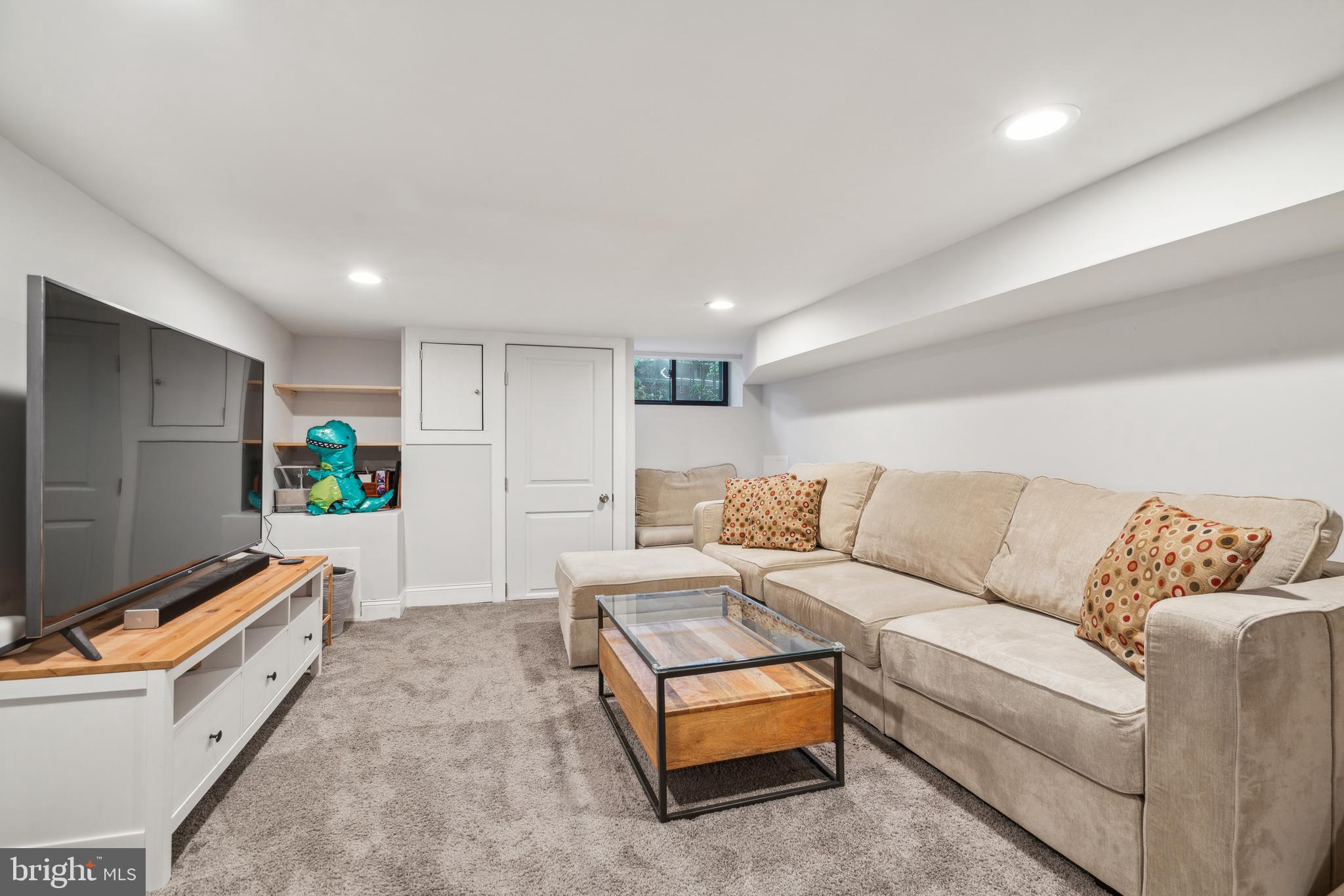 1319 Tasker Street Philadelphia, PA 19148 - Photo 22 of 23 a living room with furniture and a flat screen tv