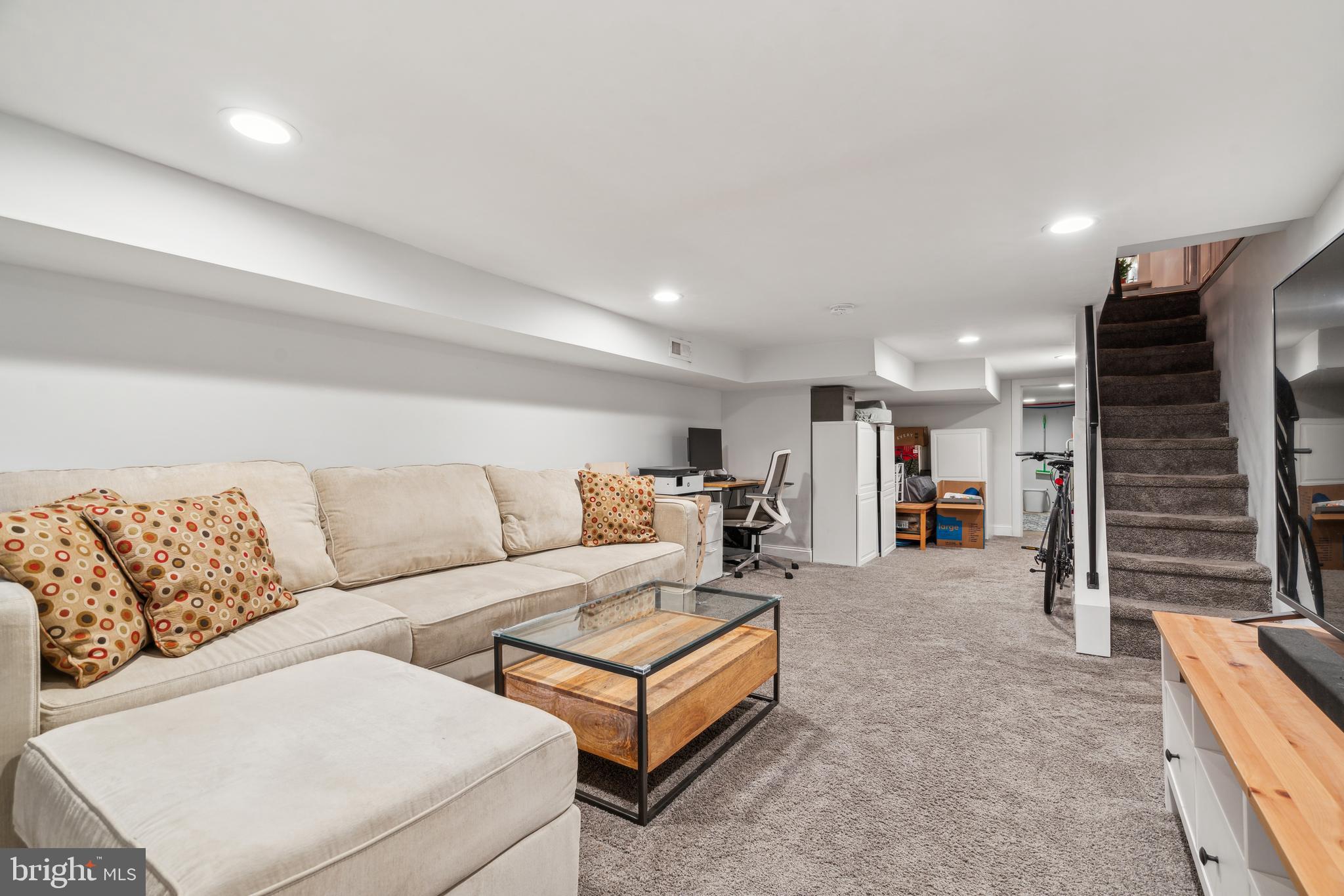 1319 Tasker Street Philadelphia, PA 19148 - Photo 23 of 23 a living room with furniture and a flat screen tv