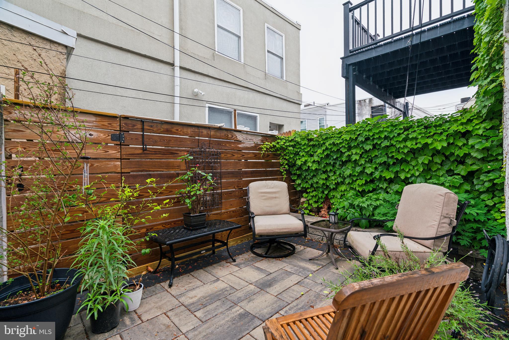 1319 Tasker Street Philadelphia, PA 19148 - Photo 9 of 23 a backyard of a house with seating space