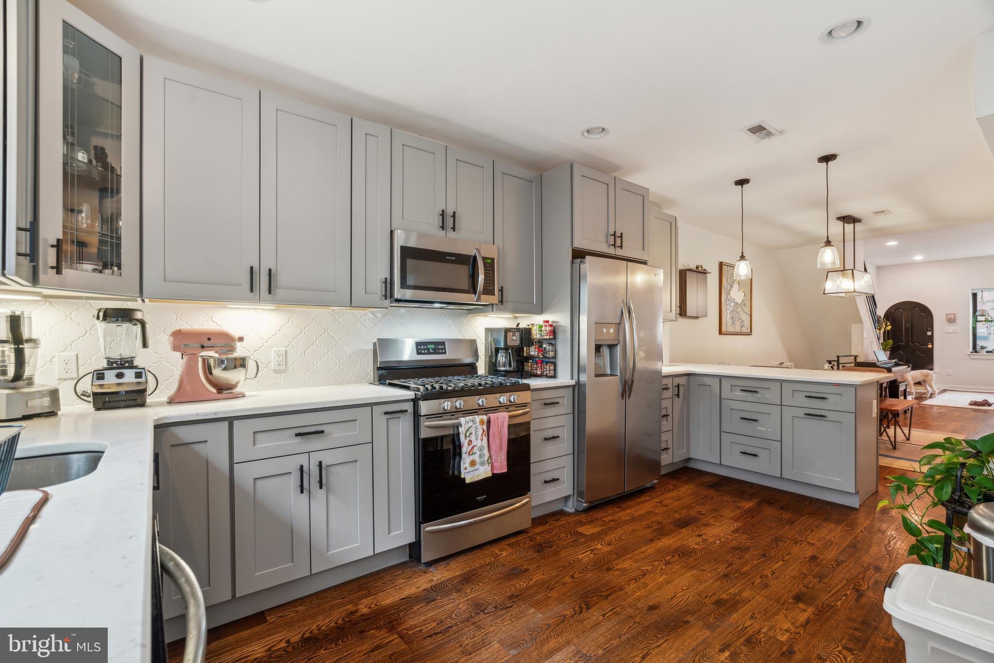 1319 Tasker Street Philadelphia, PA 19148 - Photo 10 of 23 a kitchen with a sink stove and refrigerator