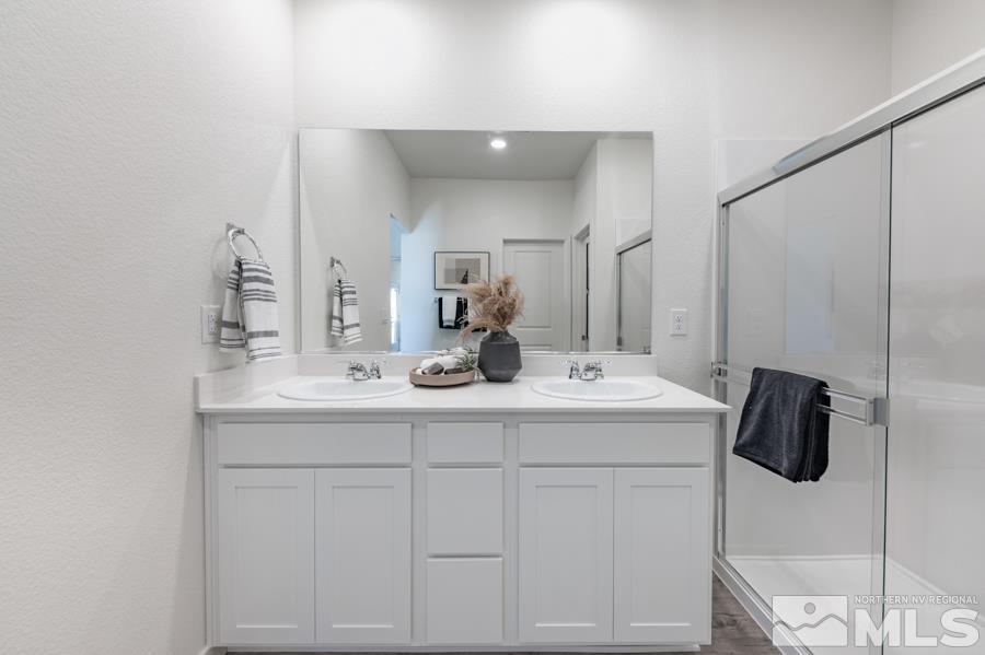 506 Russell Road, Unit LOT #95 Dayton, NV 89403 - Photo 13 of 21 a bathroom with a sink and a mirror