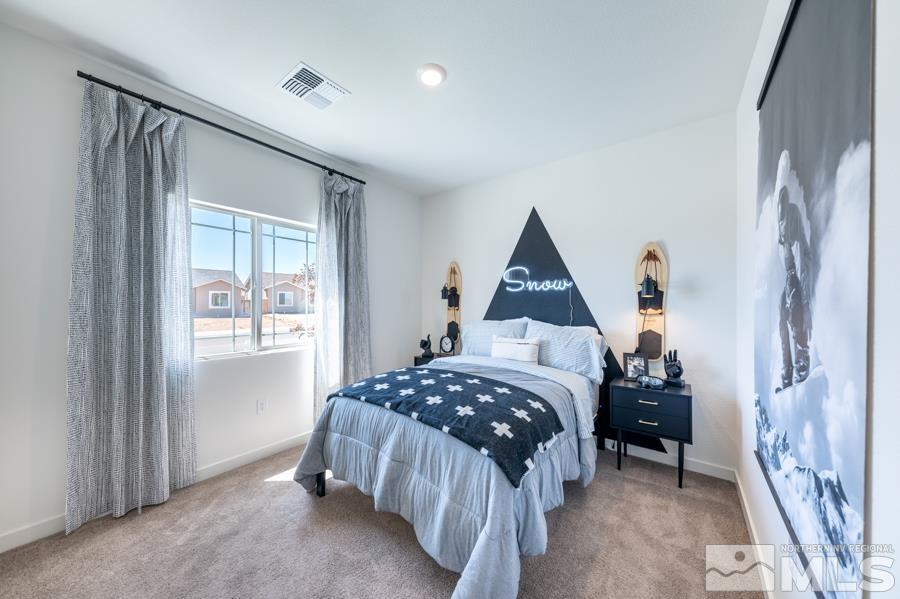 506 Russell Road, Unit LOT #95 Dayton, NV 89403 - Photo 17 of 21 a bedroom with a bed and a window