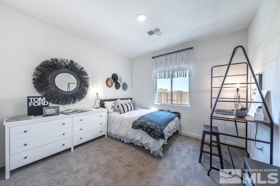 506 Russell Road, Unit LOT #95 Dayton, NV 89403 - Photo 19 of 21 a bedroom with a bed and window