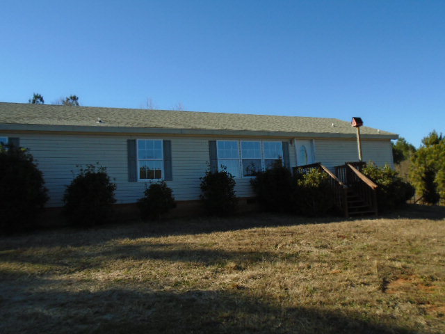 825 Old Indian Springs Road Forsyth, GA 31029 - Photo 1 of 21 a view of swimming pool in front of residential houses