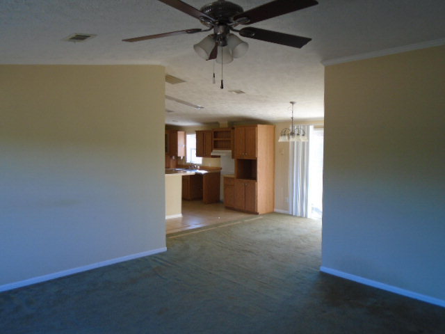 825 Old Indian Springs Road Forsyth, GA 31029 - Photo 6 of 21 a view of a kitchen with a sink and a refrigerator