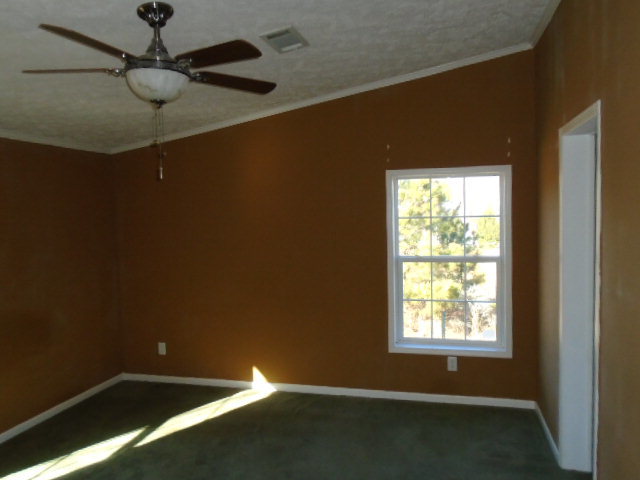 825 Old Indian Springs Road Forsyth, GA 31029 - Photo 7 of 21 a view of an empty room with a window