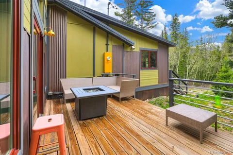 a view of a two chairs in the balcony