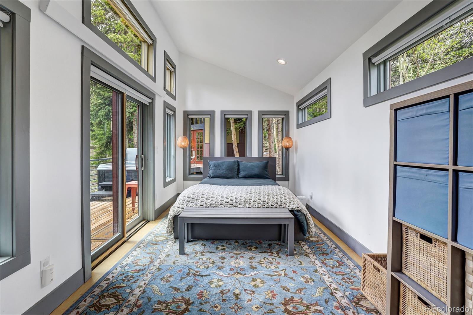 3049 County Road 6 Alma, CO 80420 - Photo 7 of 43 a living room with a bed furniture and a large window