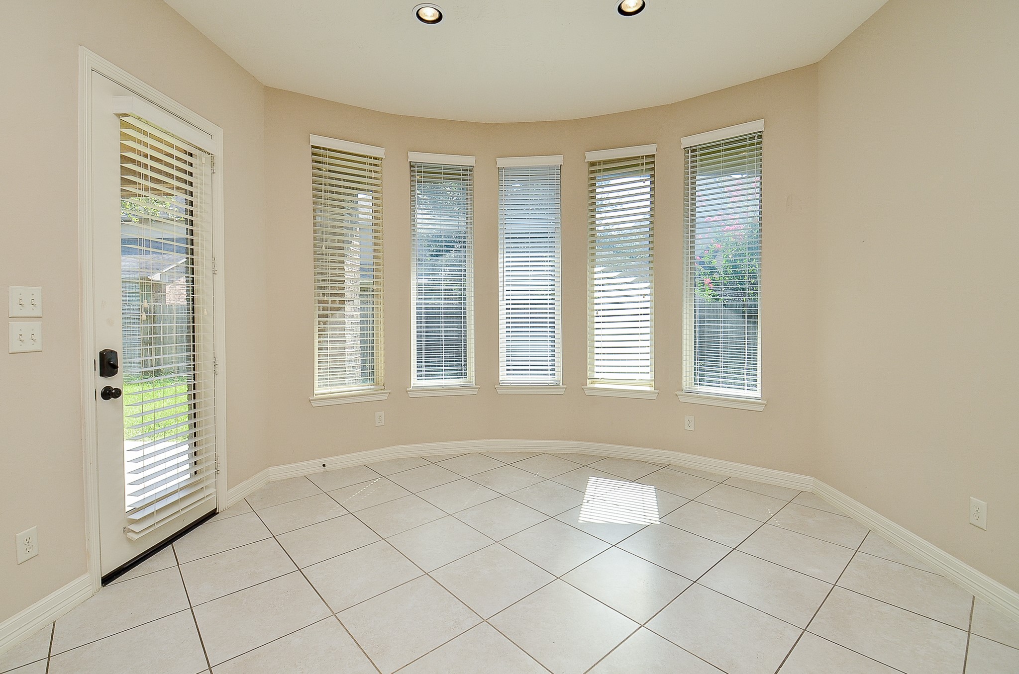 27914 Hunters Rock Lane Katy, TX 77494 - Photo 11 of 32 a view of an empty room with a window and kitchen area