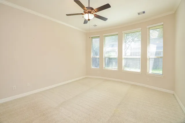 a view of an empty room with a window