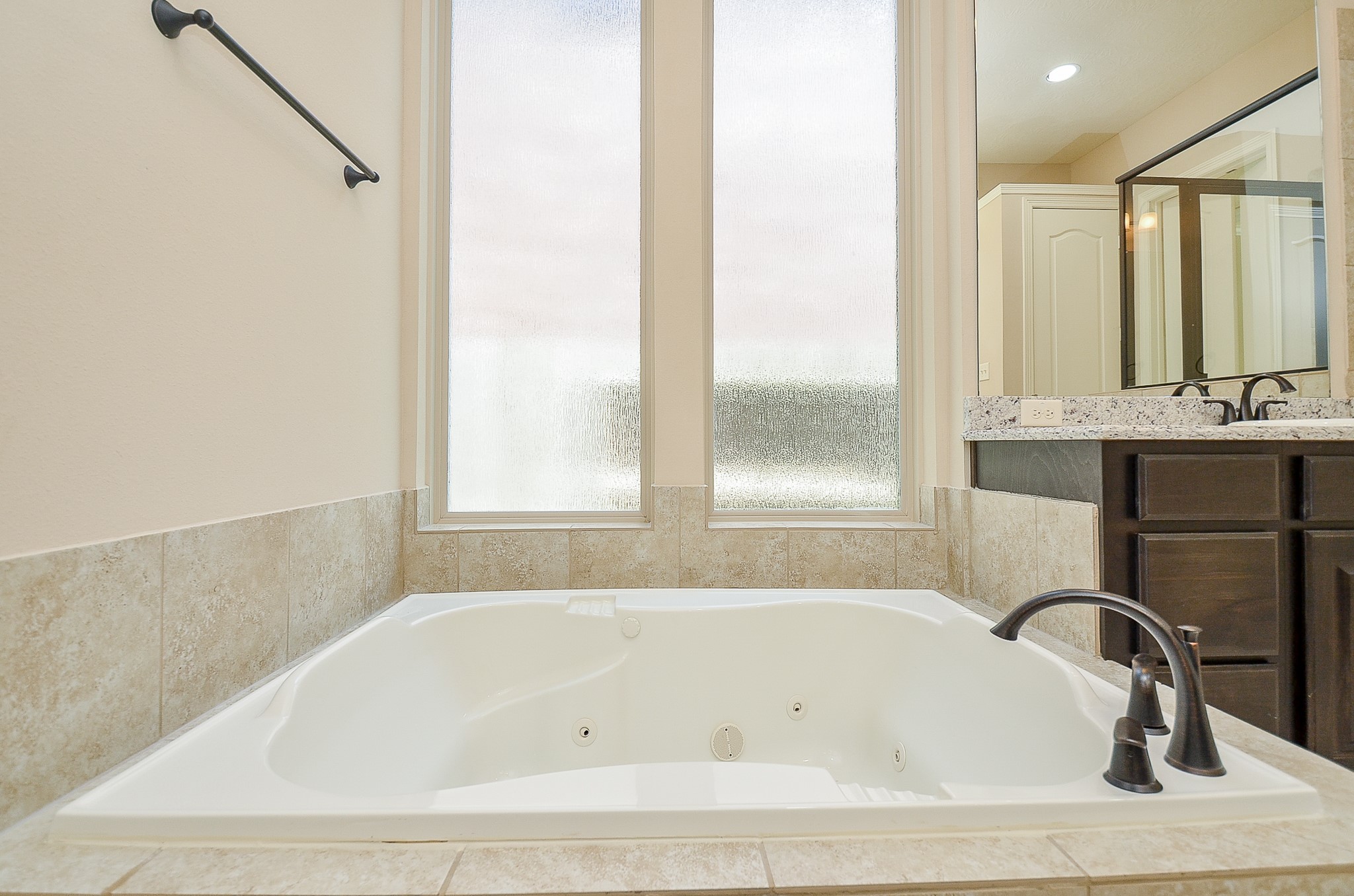 27914 Hunters Rock Lane Katy, TX 77494 - Photo 17 of 32 a white bath tub sitting in a bathroom next to a window