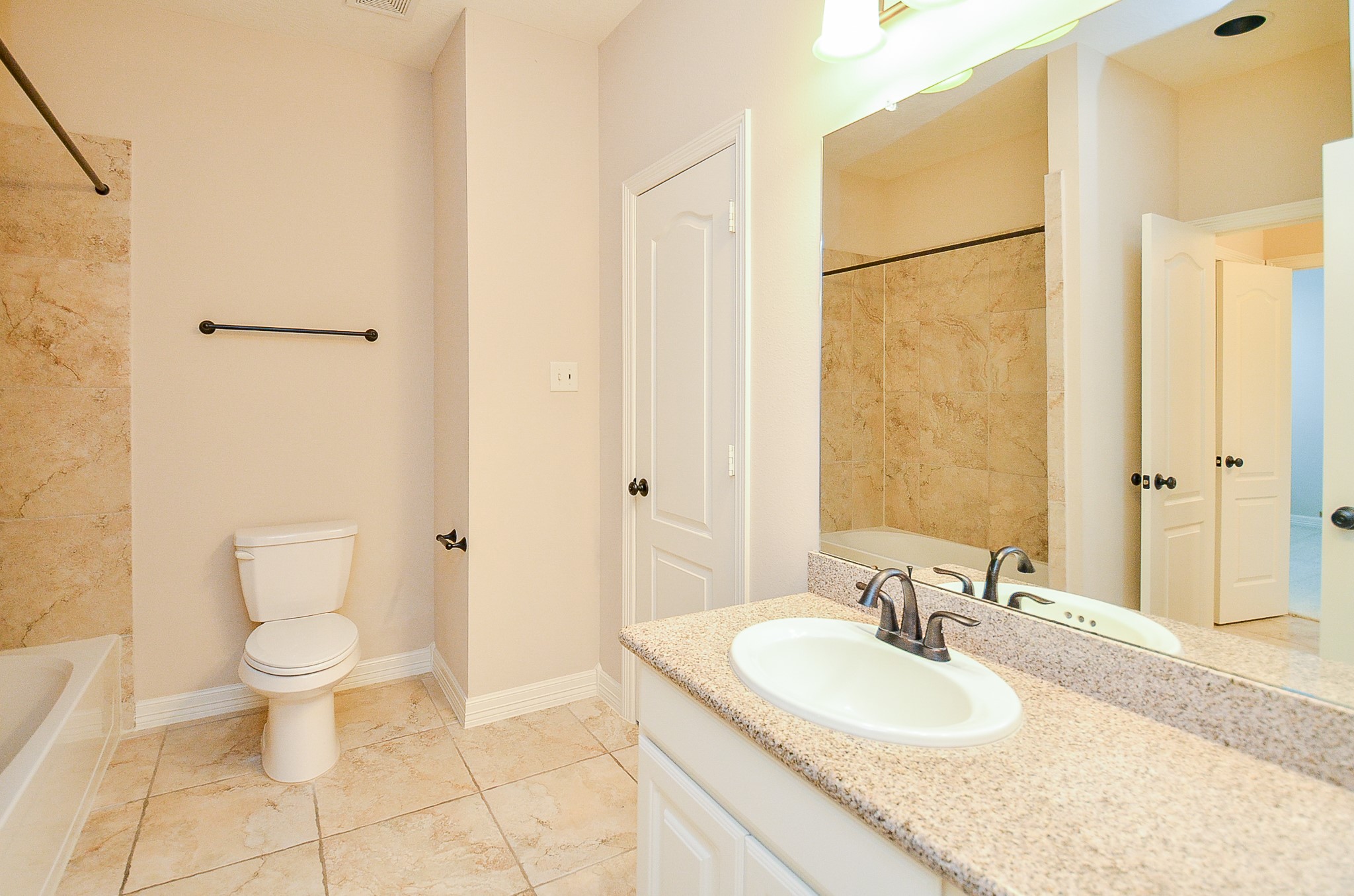 27914 Hunters Rock Lane Katy, TX 77494 - Photo 25 of 32 a bathroom with a granite countertop sink toilet and shower