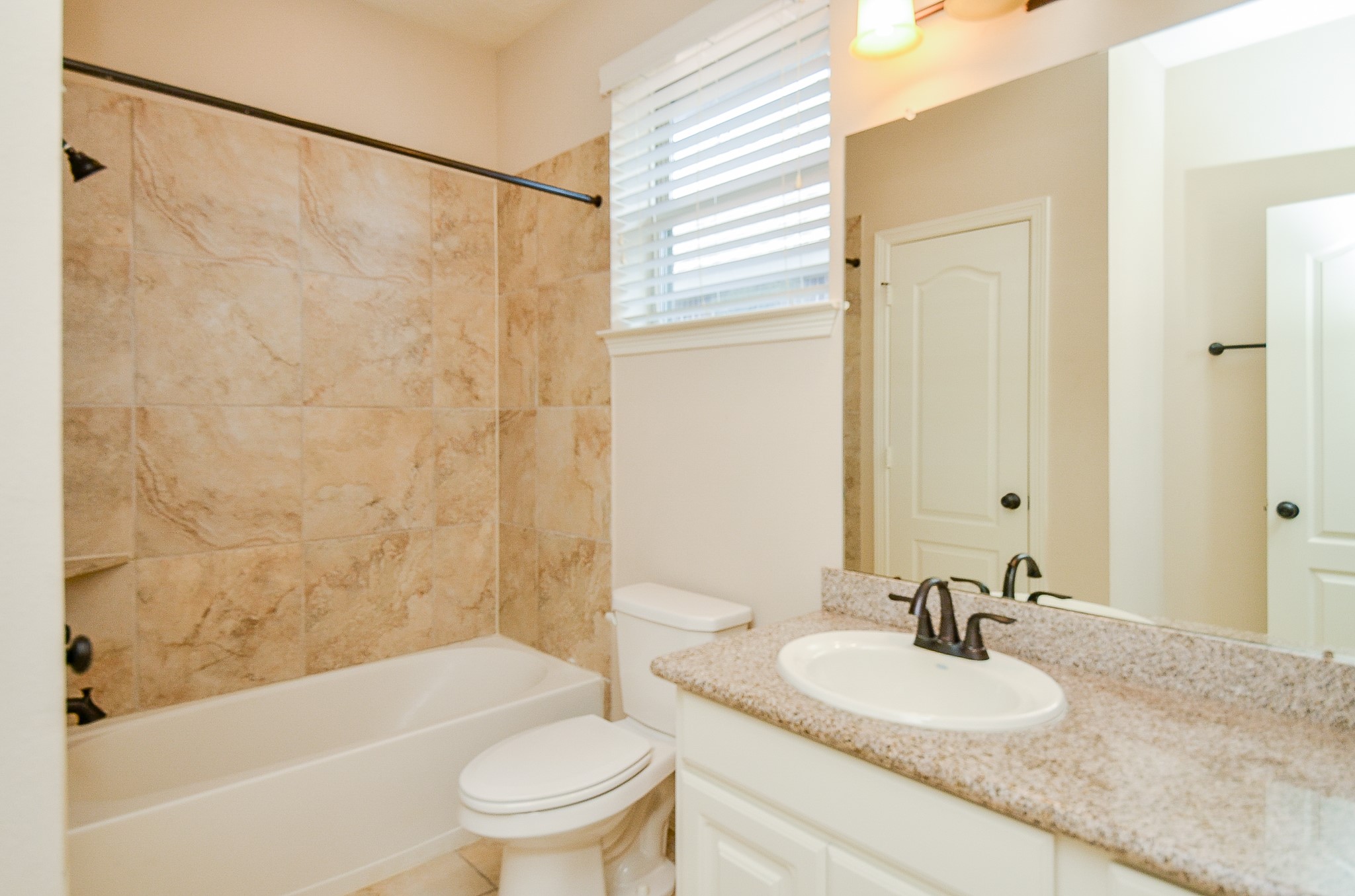 27914 Hunters Rock Lane Katy, TX 77494 - Photo 29 of 32 a bathroom with a granite countertop sink toilet and shower