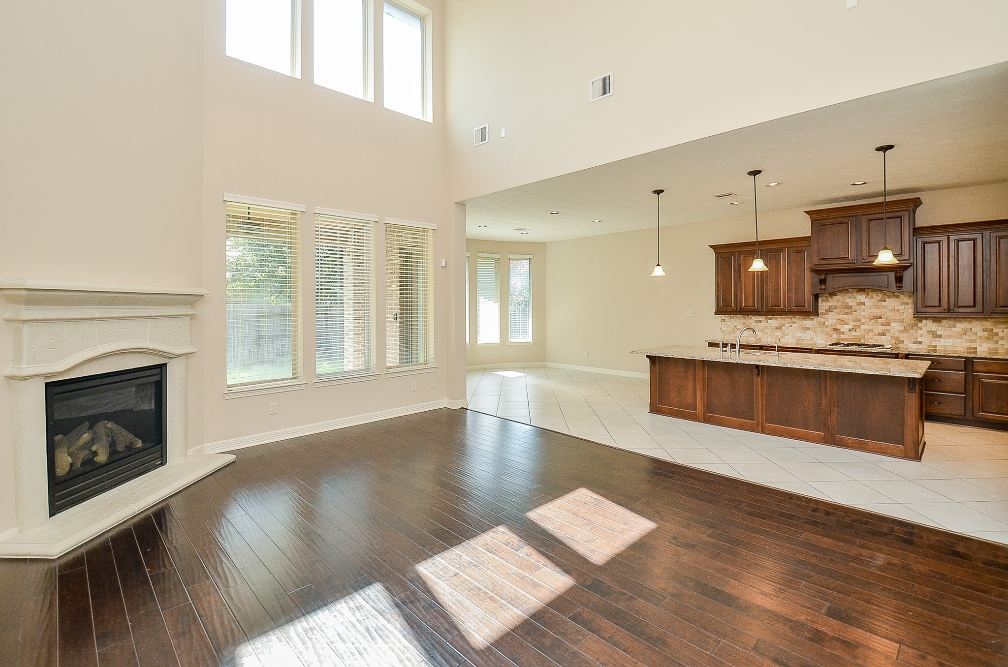 27914 Hunters Rock Lane Katy, TX 77494 - Photo 4 of 32 a view of kitchen with granite countertop cabinets and wooden floor