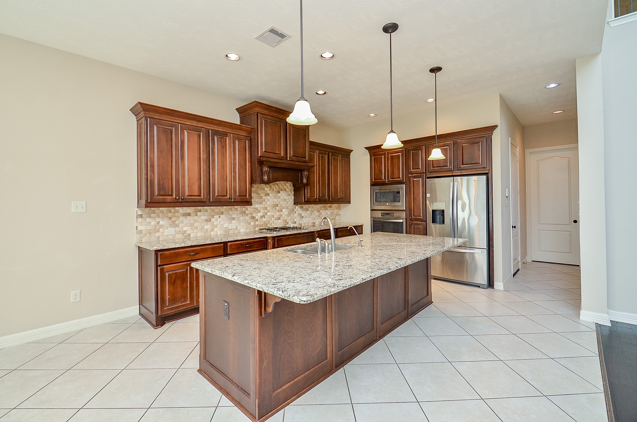 27914 Hunters Rock Lane Katy, TX 77494 - Photo 7 of 32 a kitchen with stainless steel appliances granite countertop a sink a oven a counter space and cabinets