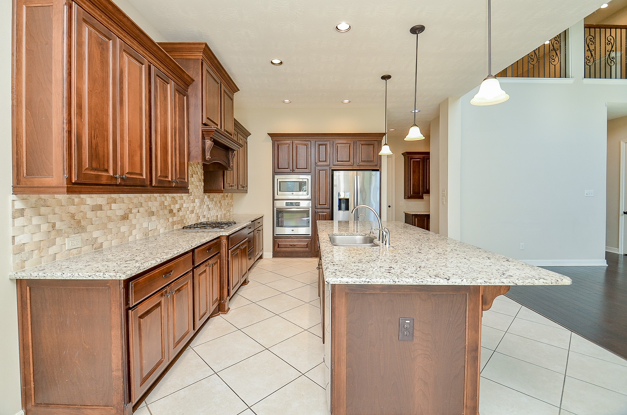 27914 Hunters Rock Lane Katy, TX 77494 - Photo 8 of 32 a kitchen with stainless steel appliances granite countertop a granite counter tops and a refrigerator
