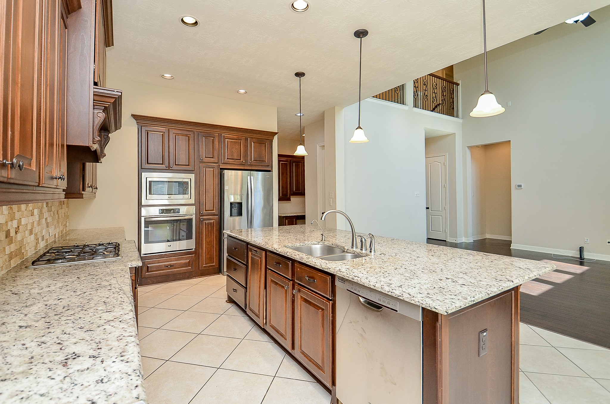 27914 Hunters Rock Lane Katy, TX 77494 - Photo 9 of 32 a kitchen with stainless steel appliances granite countertop a sink and cabinets