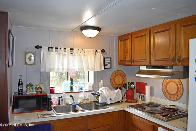 a room with furniture a rug and a window
