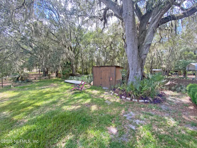 a backyard of a house with lots of green space