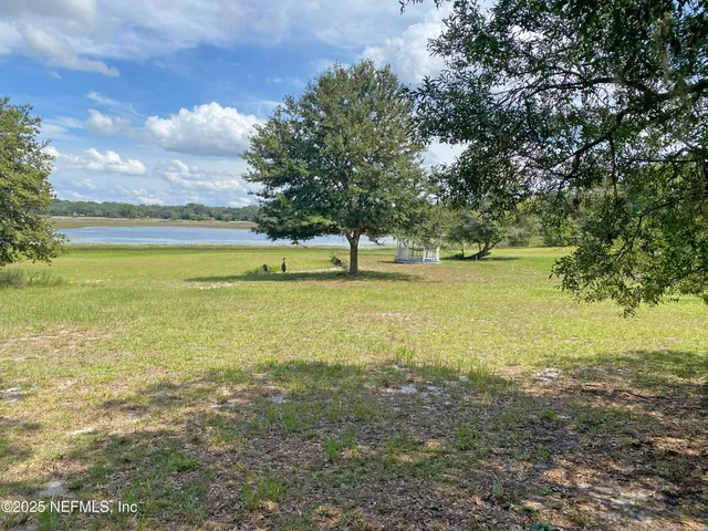 a view of an ocean and a mountain
