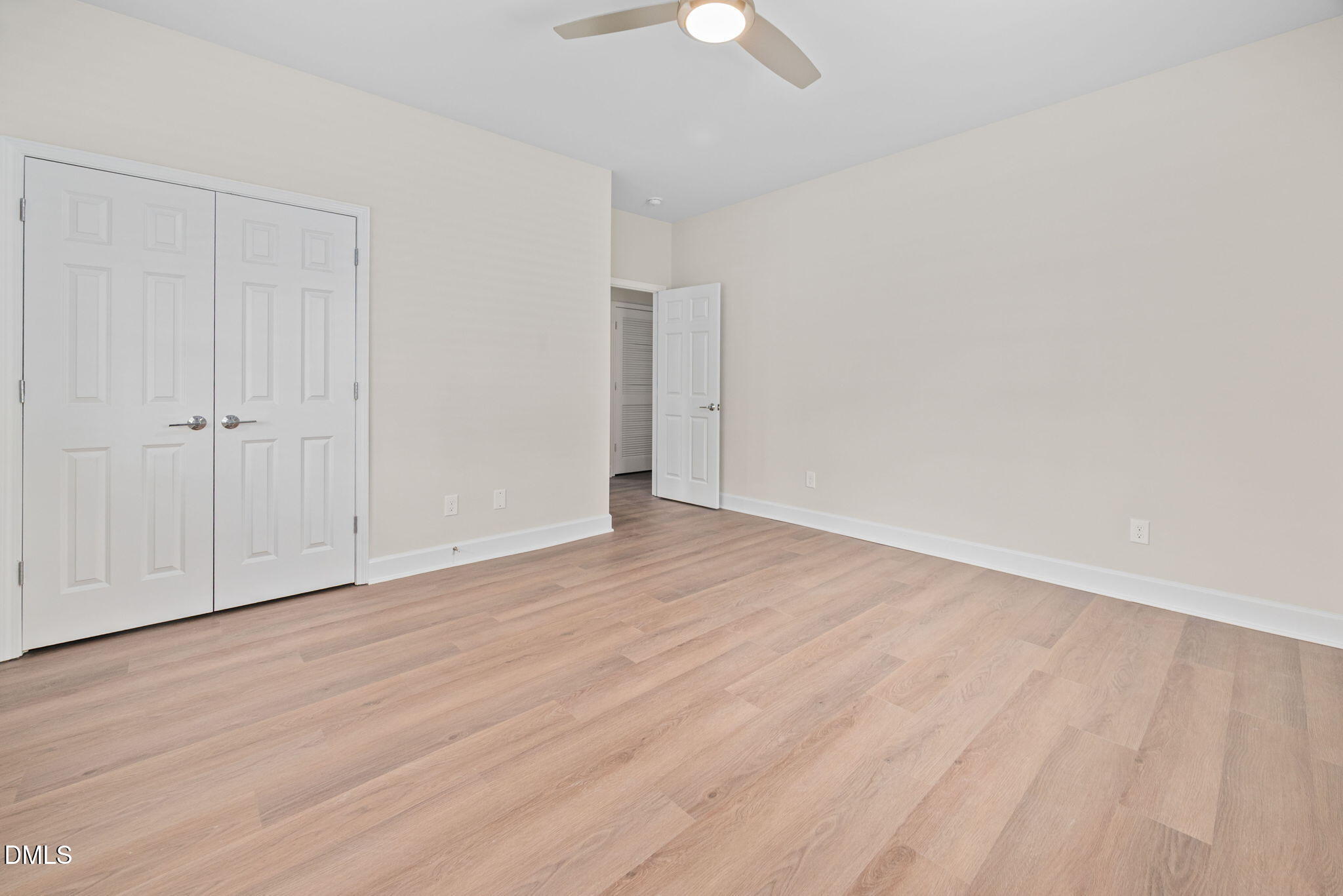 1106 South Blount Street Raleigh, NC 27601 - Photo 12 of 33 a view of an empty room with wooden floor